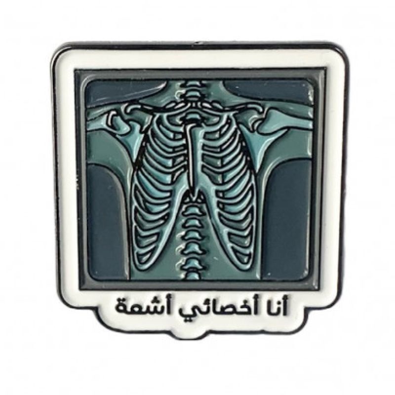 A Black Metallic Enamel Pin With The Phrase I'M Radiologist